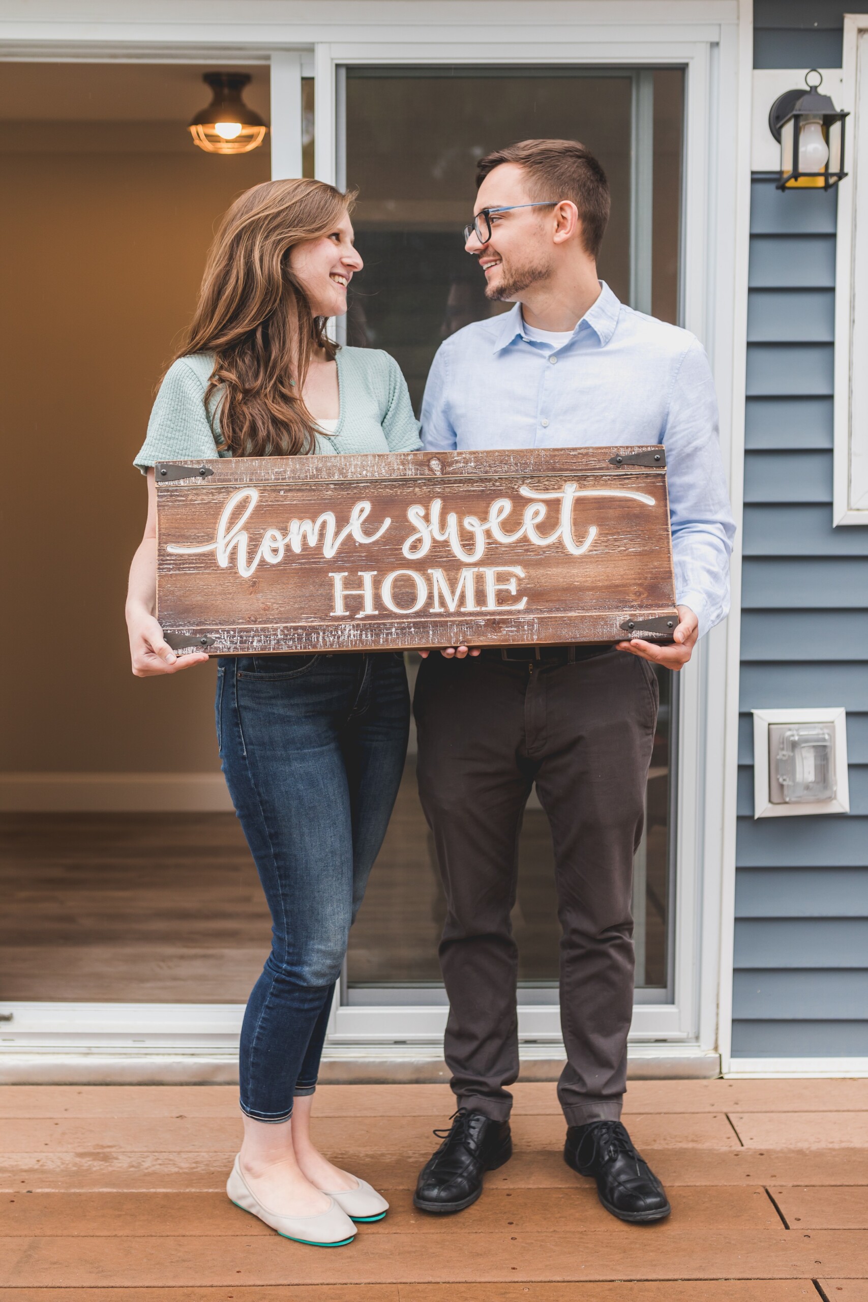 couple-with-home-sign.jpg